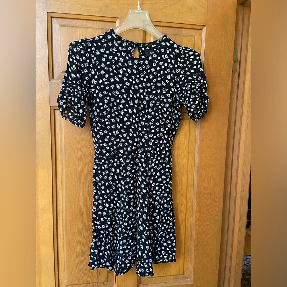Reformation black print mini dress.